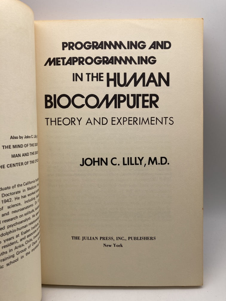 Programming and Metaprogramming in the Human Biocomputer