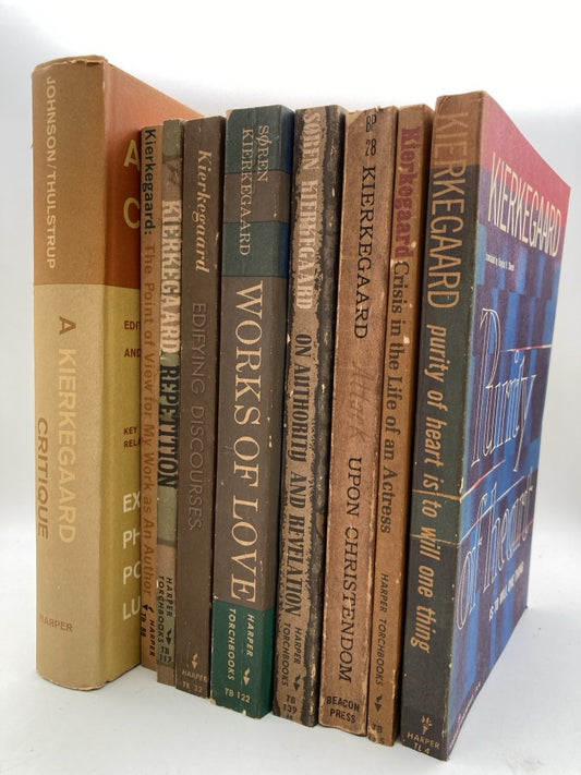 Collection of books by Søren Kierkegaard on a white background